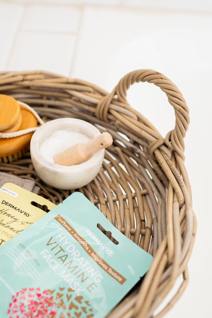 Rattan Tray with a small white container, wooden spoon, and packets on a light background