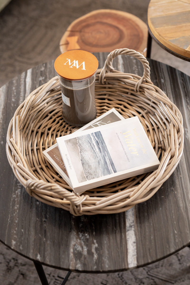 Rattan Tray with a bottle and books on a wooden table
