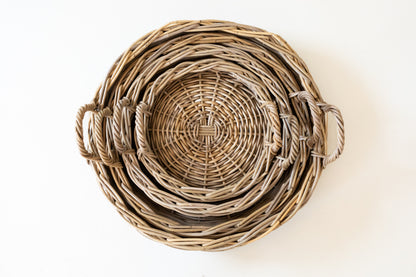 Stack of rattan tray shot from above on a white background