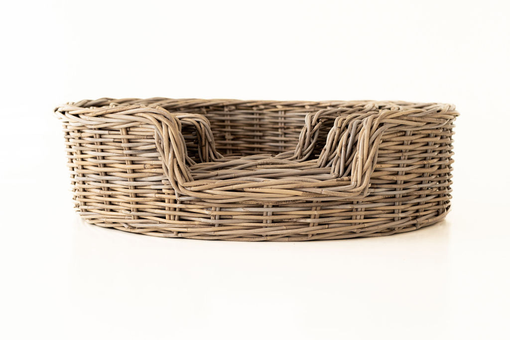 Rattan pet bed on a white background