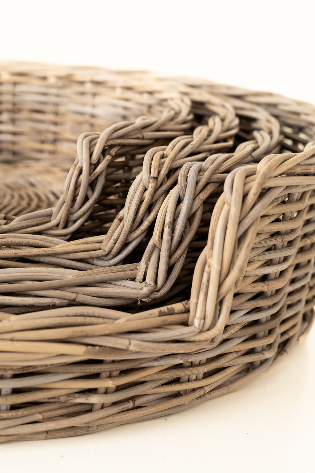 Close-up of a woven basket on a white background